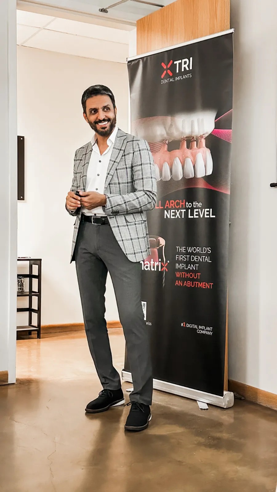 Dr. Amir Gordji, DDS, at a full-arch implant course display